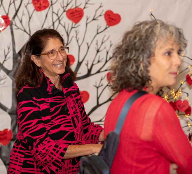 Two women in front of survivor tree
